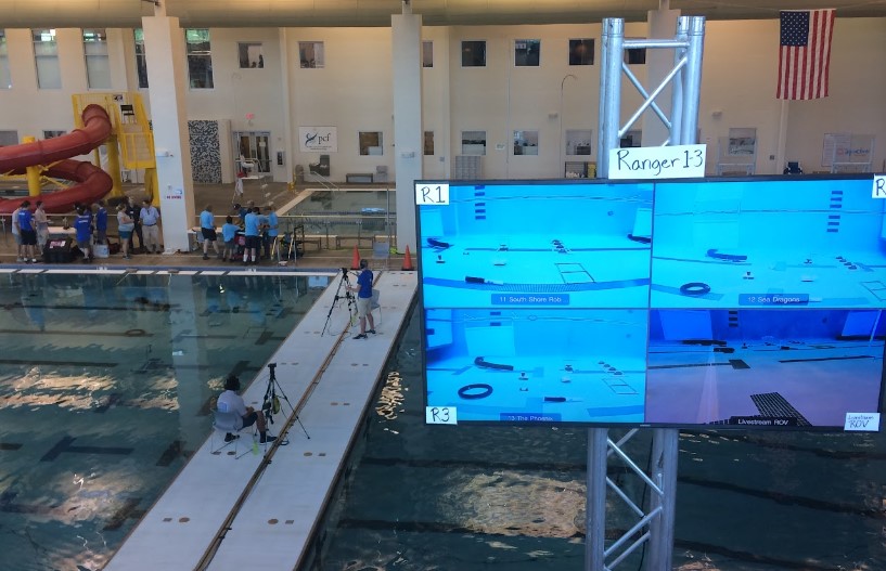South Shore Robotics team poolside at the MATE competition